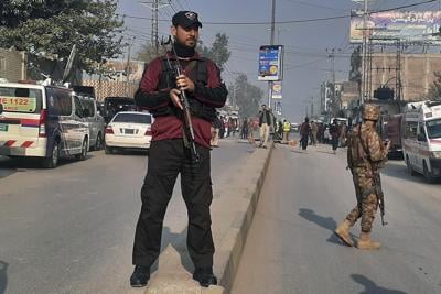 A roadside bombing in the commercial center of Pakistan's Peshawar city wounds at least 3 people